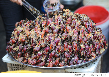 Vietnamese fermented fiddler crab sauce sale in Chau Doc Market, An Giang Province, Vietnam 107979186