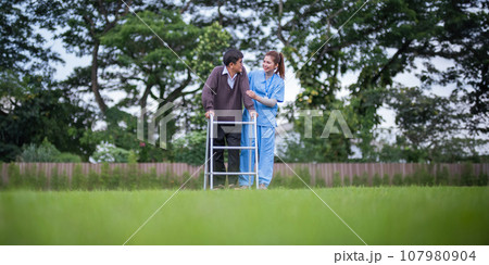 Nurse or caregiver hand on walking frame for support, help or trust moving leg in rehabilitation. Physiotherapy healthcare, Medical caregiver consulting disabled elderly patient at home 107980904