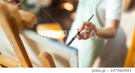hand of artist with brush painting picture art, creativity, artistic and artwork, painting concept 107980991