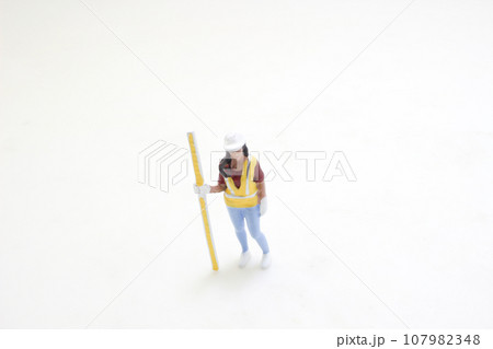 the figure of Surveyor at the construction site 107982348