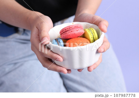 Hand with Macaroons Hand with Macaroons 107987778