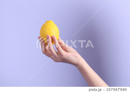 Hand with Fruit 107987990