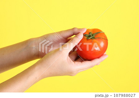 Hand with Fruit 107988027