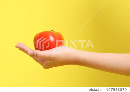 Hand with Fruit 107988079