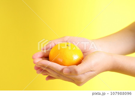 Hand with Fruit 107988096