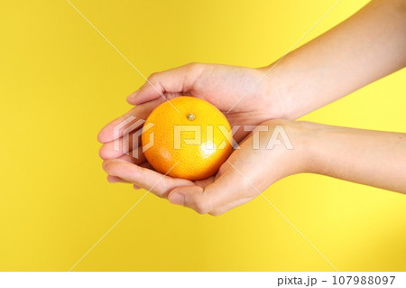 Hand with Fruit 107988097
