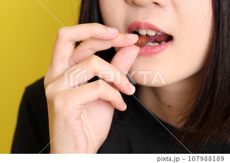 Hand with Snack 107988189