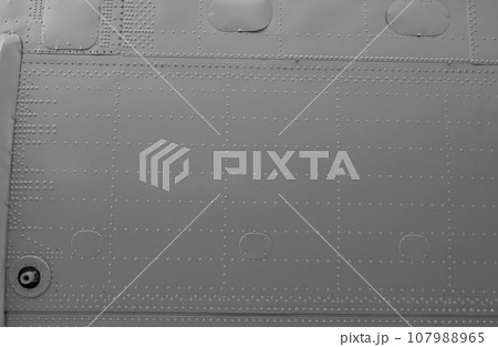 Abstract background from the metal skin of the aircraft. Abstract background from the metal skin of the aircraft. 107988965