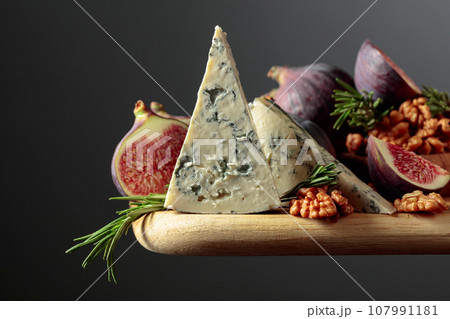 Blue cheese with figs, walnuts, and rosemary. Blue cheese with figs, walnuts, and rosemary. 107991181