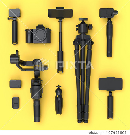 Top view of monochrome designer workspace and photography gear on yellow Top view of monochrome designer workspace and photography gear on yellow 107991801