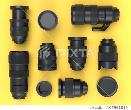 Top view of monochrome designer workspace and photography gear on yellow 107991810