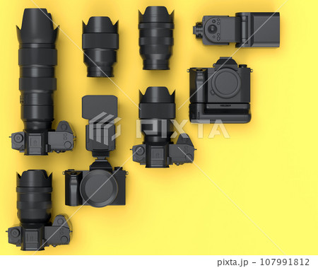 Top view of monochrome designer workspace and photography gear on yellow 107991812