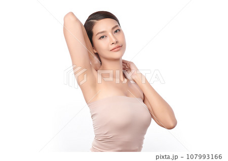Beautiful Young Asian woman lifting hands up to show off clean and hygienic armpits or underarms on white background, Smooth armpit cleanliness and protection concept 107993166
