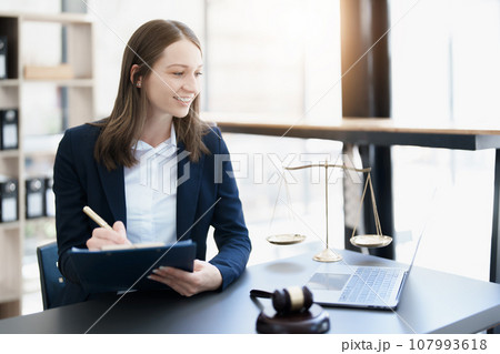 Portrait of a Asian woman lawyer studying a lawsuit for a client before going to court. Portrait of a Asian woman lawyer studying a lawsuit for a client before going to court. 107993618