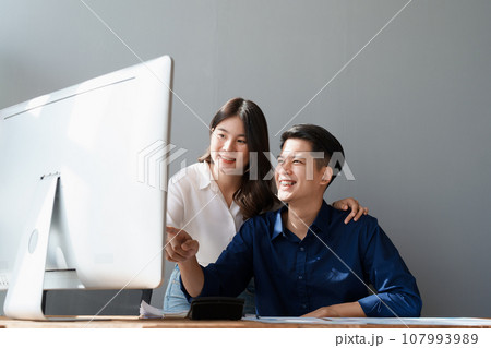 Startup family business, husband and wife discussing financial affairs, investing, making profit, tax deduction from trading using computer and investment budget paperwork working. Startup family business, husband and wife discussing financial affairs, investing, making profit, tax deduction from trading using computer and investment budget paperwork working. 107993989