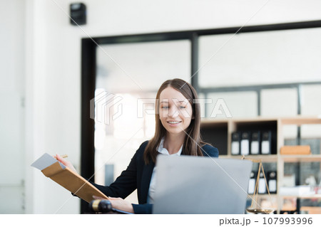 Portrait of a Asian woman lawyer studying a lawsuit for a client before going to court Portrait of a Asian woman lawyer studying a lawsuit for a client before going to court 107993996