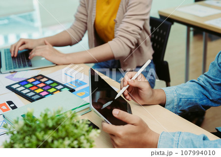 Group of asian creative team programing designers participate in all phases of the UX UI design 107994010