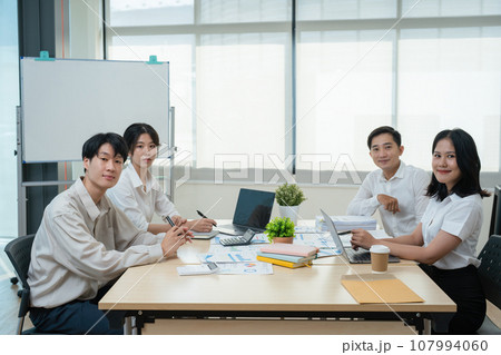 Asian business advisor meeting to analyze and discuss the situation on the financial report in the meeting room.Investment Consultant, Financial , teamwork ,brainstorming ,startup and accounting. Asian business advisor meeting to analyze and discuss the situation on the financial report in the meeting room.Investment Consultant, Financial , teamwork ,brainstorming ,startup and accounting. 107994060