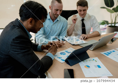 Asian business advisor meeting to analyze and discuss the situation on the financial report in the meeting room.Investment Consultant, Financial , teamwork ,brainstorming ,startup and accounting. Asian business advisor meeting to analyze and discuss the situation on the financial report in the meeting room.Investment Consultant, Financial , teamwork ,brainstorming ,startup and accounting. 107994434