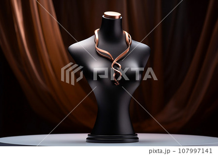 Luxury jewelry on stand. Golden necklace on bust mannequin in the store. Jewelry showcase, selective focus Luxury jewelry on stand. Golden necklace on bust mannequin in the store. Jewelry showcase, selective focus 107997141