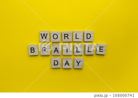 January 4, World Braille Day, minimalistic banner with the inscription in wooden letters January 4, World Braille Day, minimalistic banner with the inscription in wooden letters 108000741