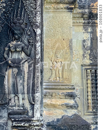 The famous bas-relief of Apsaras, celestial maidens, with intricate hairstyles on the inside wall of the first floor of the Angkor Wat temple in Siem Reap, Cambodia. 108001833