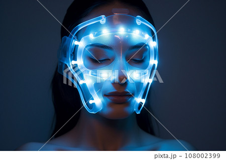 Woman with led light therapy facial beauty mask, photon therapy. Cosmetic procedure for woman face, LED facial mask treatment. Professional cosmetology anti-aging procedure. Skin care, spa and health. Woman with led light therapy facial beauty mask, photon therapy. Cosmetic procedure for woman face, LED facial mask treatment. Professional cosmetology anti-aging procedure. Skin care, spa and health. 108002399