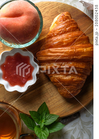Croissant with tea and jam for breakfast Croissant with tea and jam for breakfast 108002438
