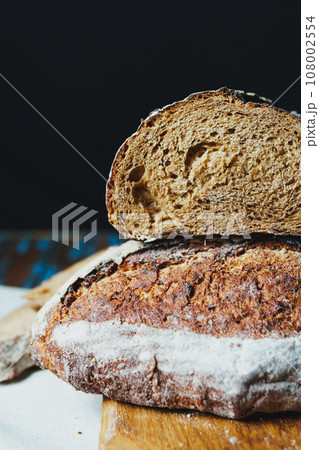 Freshly baked bread with a golden crust close up 108002554
