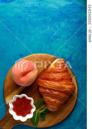 Croissant with tea and jam for breakfast Croissant with tea and jam for breakfast 108002645