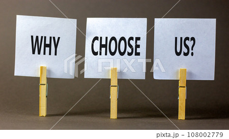 Why choose us symbol. Concept word Why choose us on beautiful white paper on wooden clothespin. Beautiful grey table grey background. Business motivational why choose us concept. Copy space. 108002779