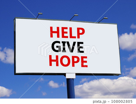 Help give hope symbol. Concept word Help give hope on beautiful big white billboard. Beautiful blue sky background. Business motivational help give hope concept. Copy space. Help give hope symbol. Concept word Help give hope on beautiful big white billboard. Beautiful blue sky background. Business motivational help give hope concept. Copy space. 108002805