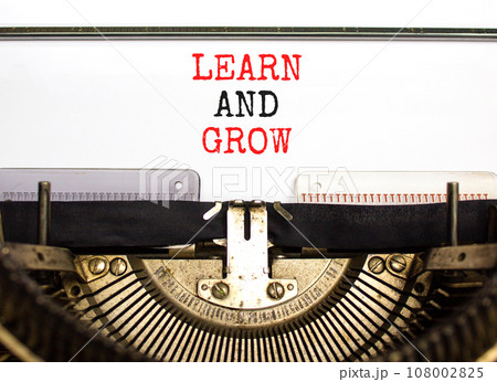 Learn and grow symbol. Concept word Learn And Grow typed on beautiful retro old typewriter. Beautiful white paper background. Business, education learn and grow concept. Copy space. Learn and grow symbol. Concept word Learn And Grow typed on beautiful retro old typewriter. Beautiful white paper background. Business, education learn and grow concept. Copy space. 108002825