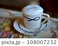 The Cup of cappuccino on a wooden table in a cafe. Beautiful foam, white ceramic cup, copy space. 108007232