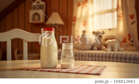 baby food, milk or formula for the baby against the background of a cozy baby room. High quality photo 108012661