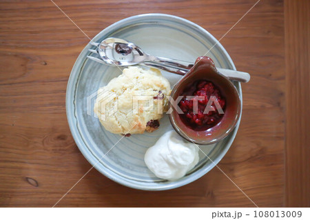 scone , cranberry scone or scone with whipped cream 108013009