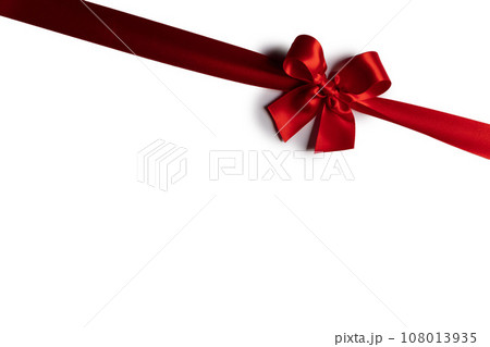 Red ribbon bow isolated on white Red ribbon bow isolated on white 108013935
