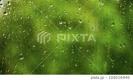 raindrops on a glass window against a background of green foliage, backgrounds, textures raindrops on a glass window against a background of green foliage, backgrounds, textures 108016940