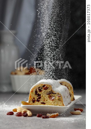 Traditional fruit cake for Christmas with raisins and nuts. 108017373