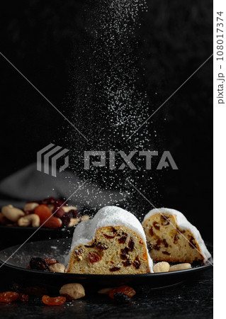 Traditional fruit cake for Christmas with raisins and nuts. 108017374