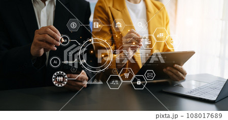 Working team meeting concept, business using laptop and smart phone and digital tablet computer with digital marketing media  in virtual icon network diagram office 108017689