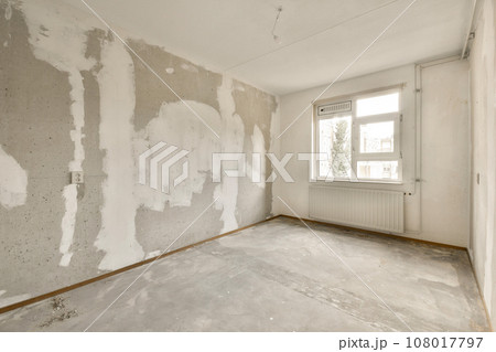 an empty room with white paint on the walls, and no one person is standing in it or someone's house an empty room with white paint on the walls, and no one person is standing in it or someone's house 108017797