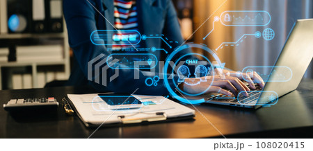 Man using chatbot in computer and tablet smart intelligence Ai.Chat with AI Artificial Intelligence, developed by OpenAI generate. Futuristic technology, robot in online system. neon light in dark Man using chatbot in computer and tablet smart intelligence Ai.Chat with AI Artificial Intelligence, developed by OpenAI generate. Futuristic technology, robot in online system. neon light in dark 108020415