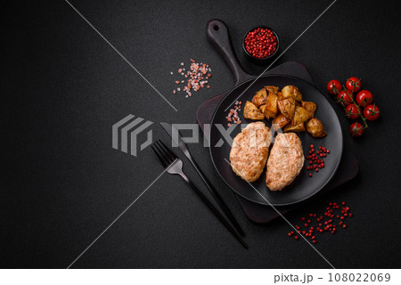 Delicious fresh chicken cutlets or meatballs with salt, spices and herbs 108022069