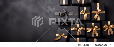 Black gift boxes arranged on dark background, black friday discounts concept 108023017