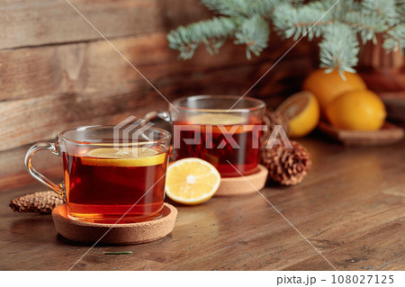 Tea with lemon on a wooden table. 108027125