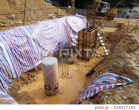 JOHOR, MALAYSIA - SEPTEMBER 03, 2020: Bore pile that has been driven into the ground and reached the required depth. It will be cut and then a pile cap will be built over it. 108027160