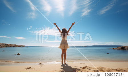 A girl is raising hands and jumping in front of the beach with clear sky in lovely dress. Generative AI. 108027184