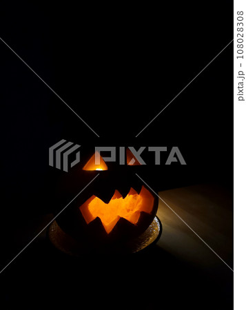 Halloween pumpkin jack o lantern isolated on dark background 108028308