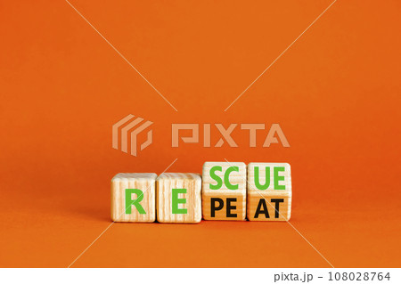 Rescue and repeat symbol. Concept words Rescue Repeat on wooden block. Beautiful orange table orange background. Business rescue and repeat concept. Copy space. 108028764